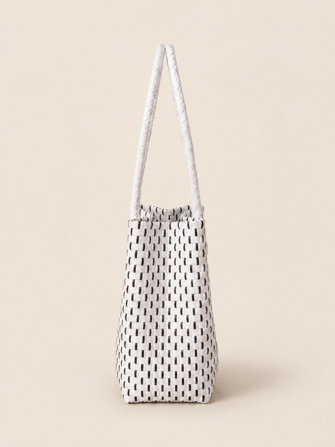 Habi Tinta recycled-polypropylene structured bayong tote, side view