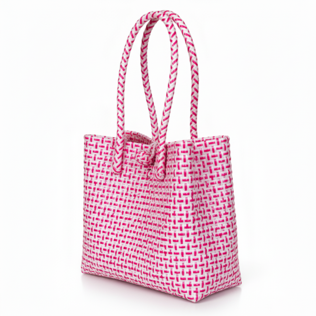 30-degree angle view of the bright pink and white handwoven bag