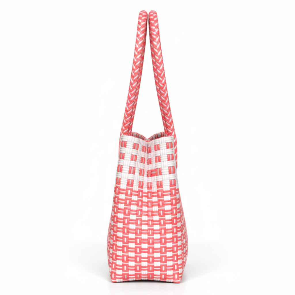 90-degree side profile of the coral pink and white handwoven bag