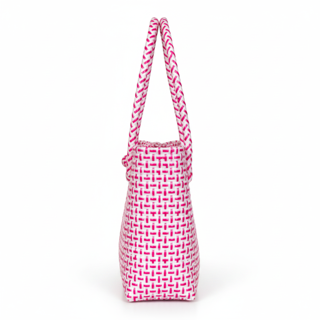 90-degree side profile of the bright pink and white handwoven bag
