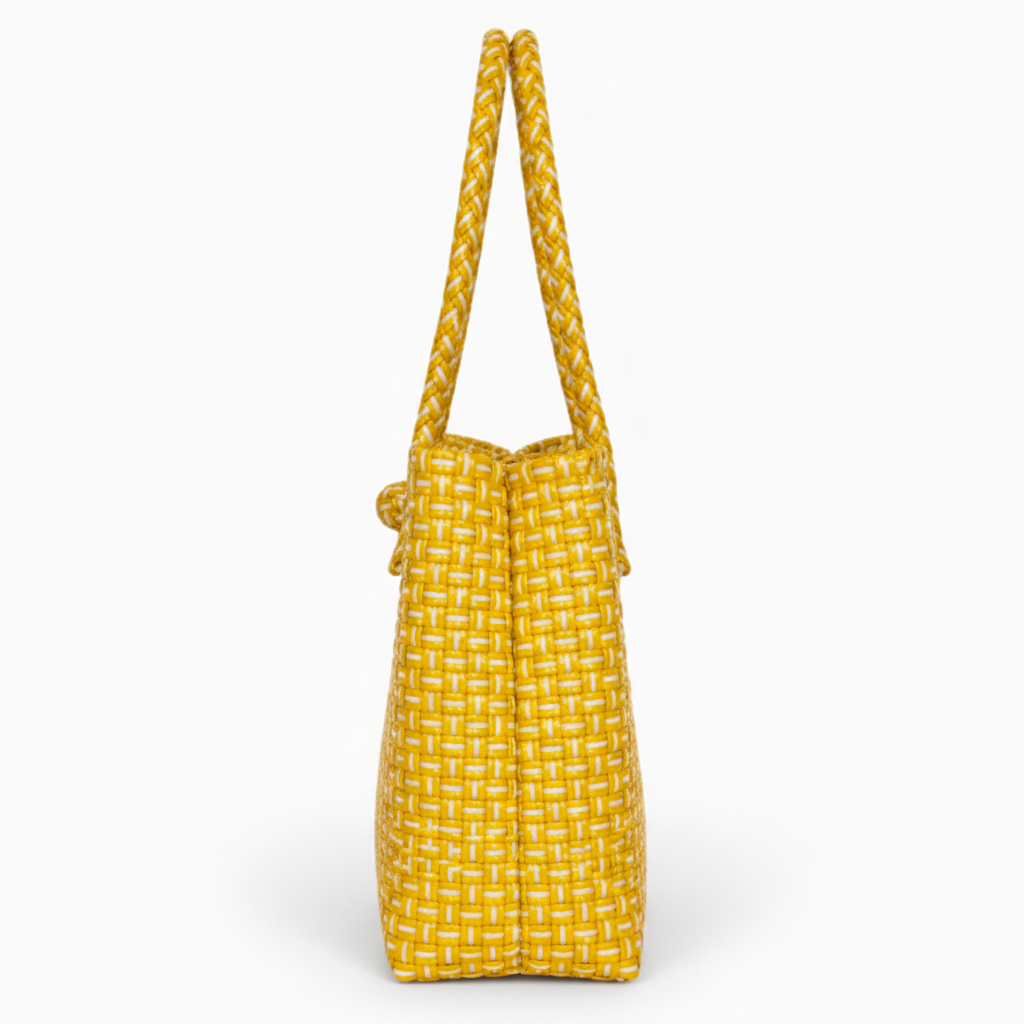 90-degree side profile of the golden yellow handwoven bag
