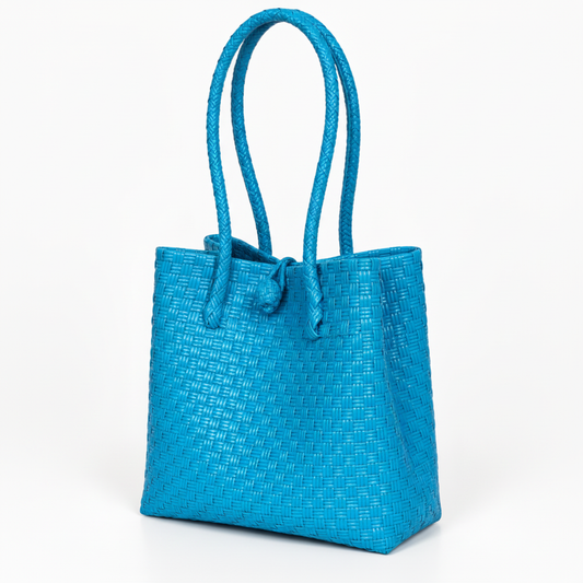 30-degree angle view of the bright blue handwoven bag