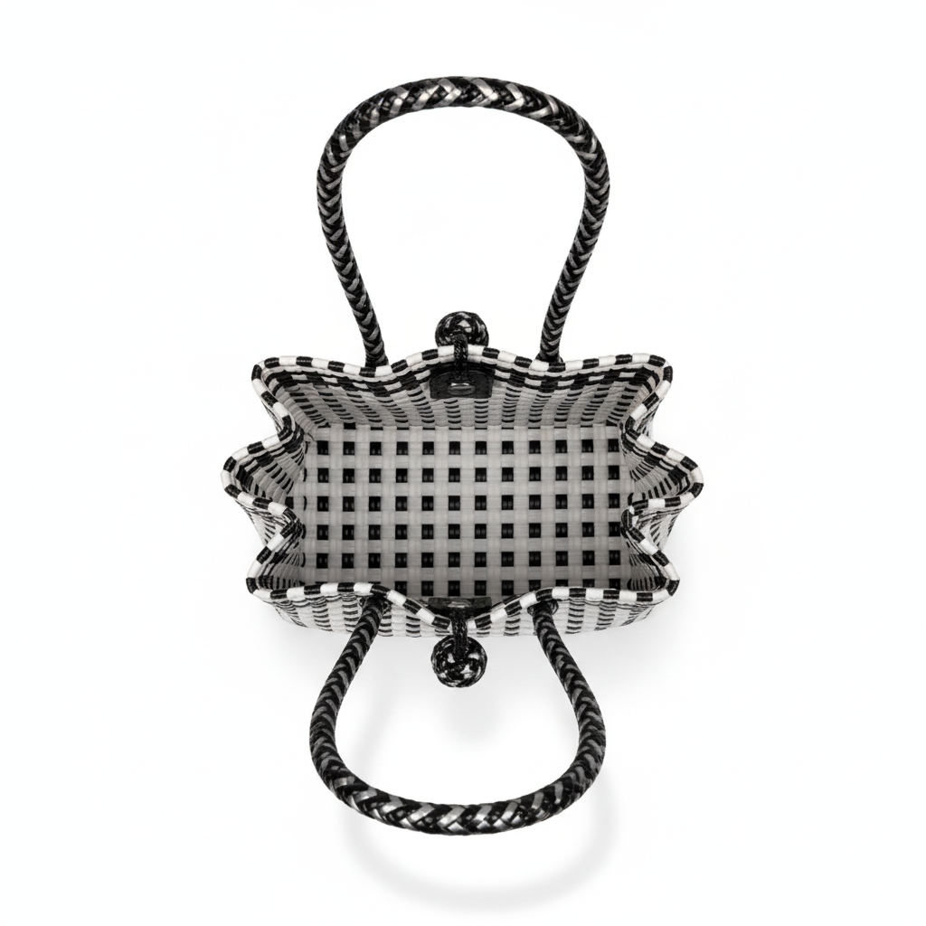 Aerial top-down view of the black and white handwoven bag
