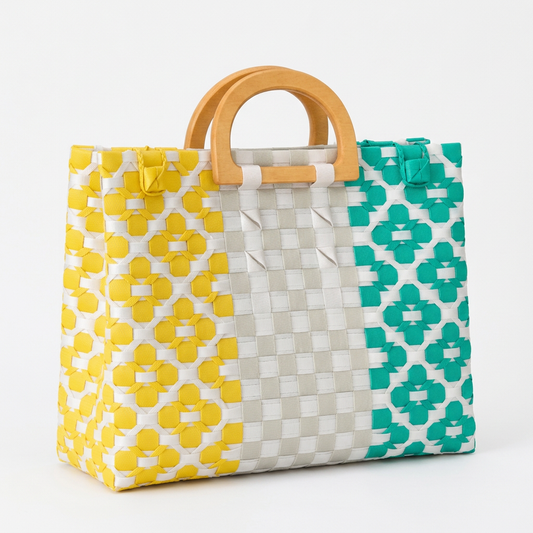 Habi Sari-Sari yellow, teal, and gray color-blocked handwoven tote bag with wooden arch handles, 30-degree angle view