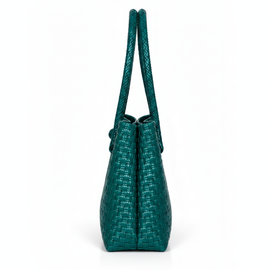 Side profile of the deep teal handwoven bag