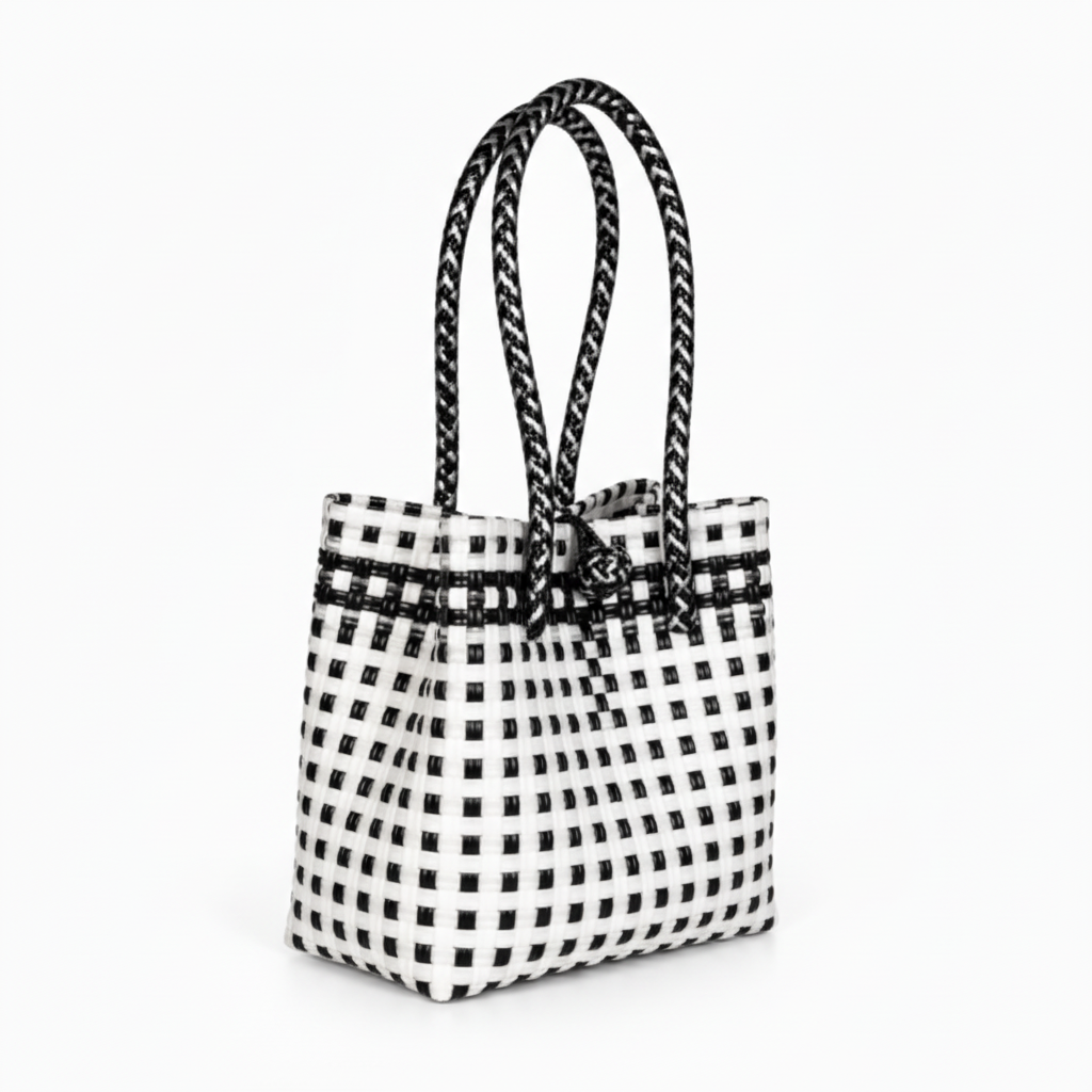 30-degree angle view of the black and white handwoven bag