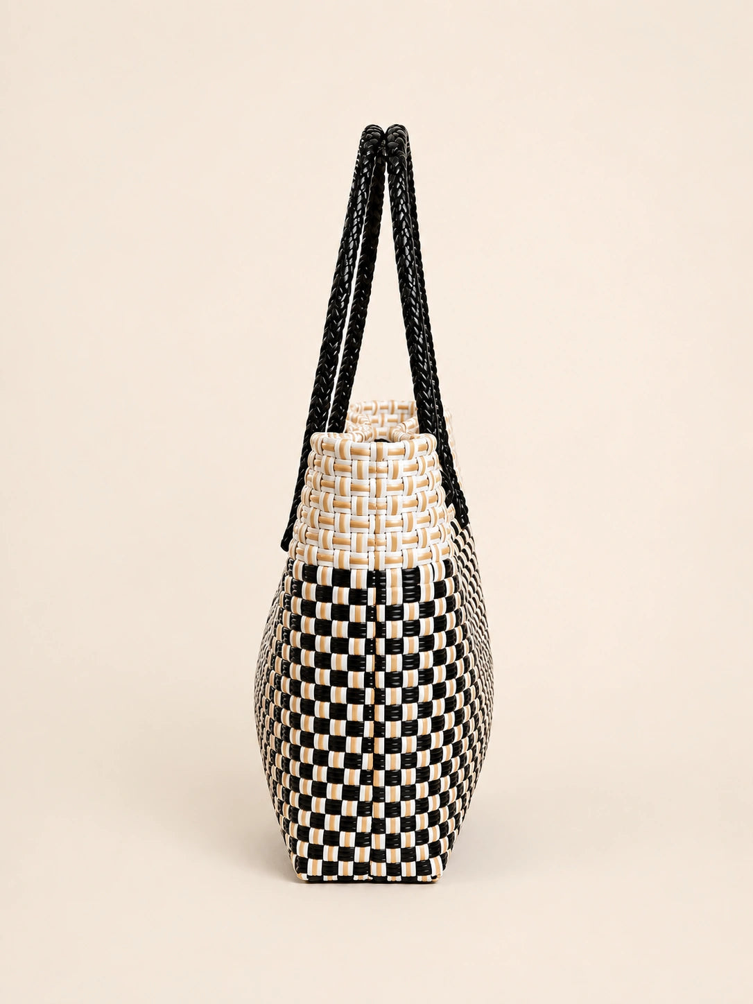 Habi Araw-Gabi recycled-polypropylene structured bayong tote, side view