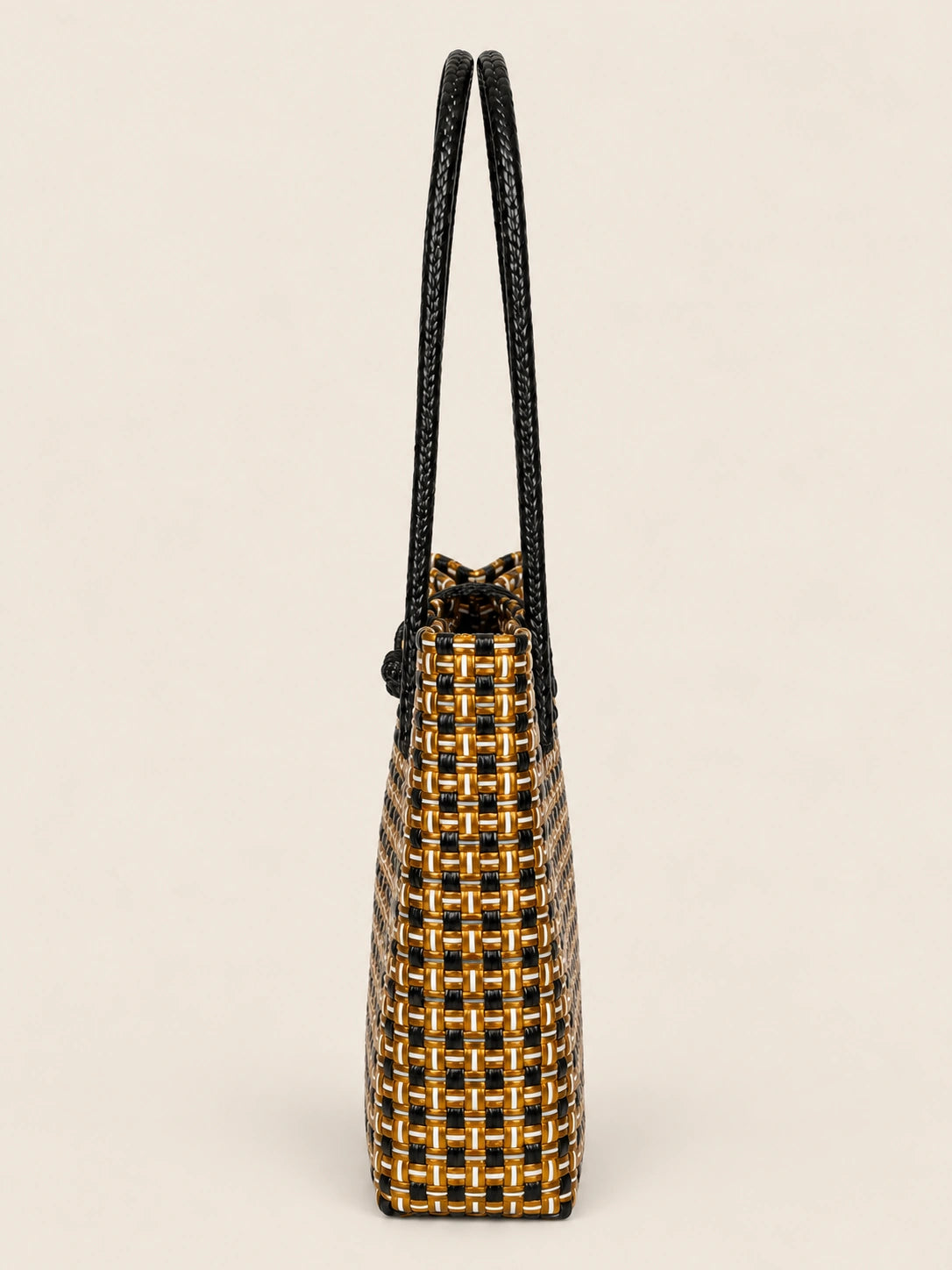 Habi Kayamanan recycled-polypropylene structured bayong tote, side view