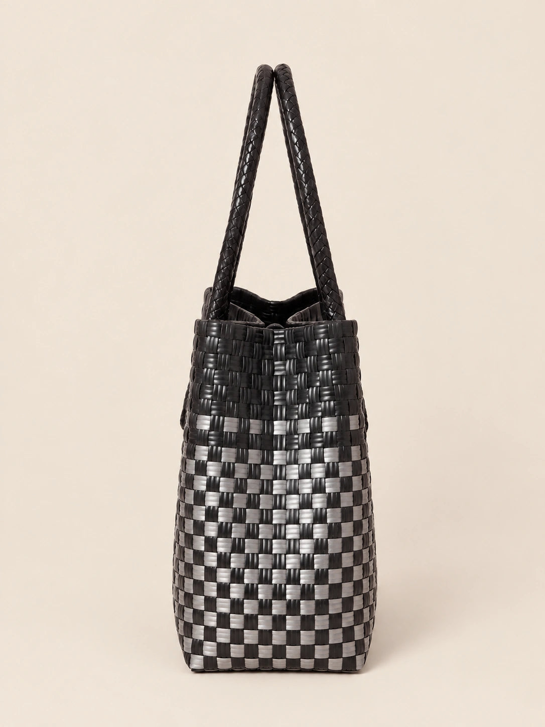 Habi Pilak — Geometriko recycled-polypropylene structured bayong tote, side view