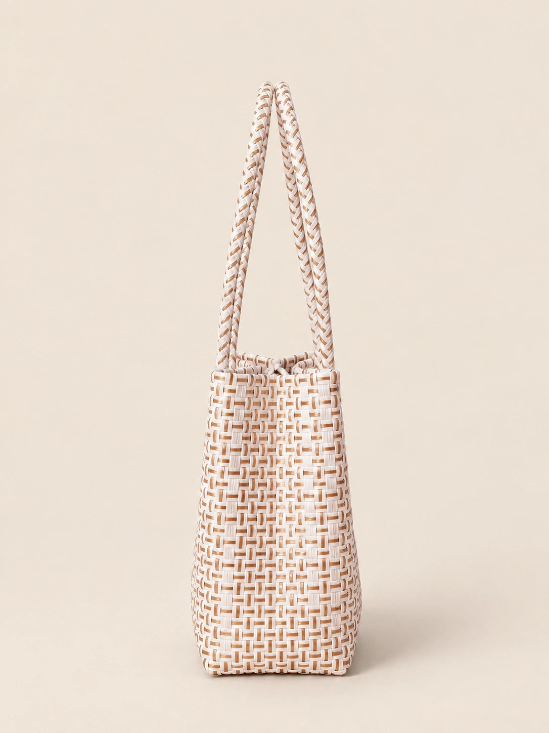 Habi Buri recycled-polypropylene structured bayong tote, side view
