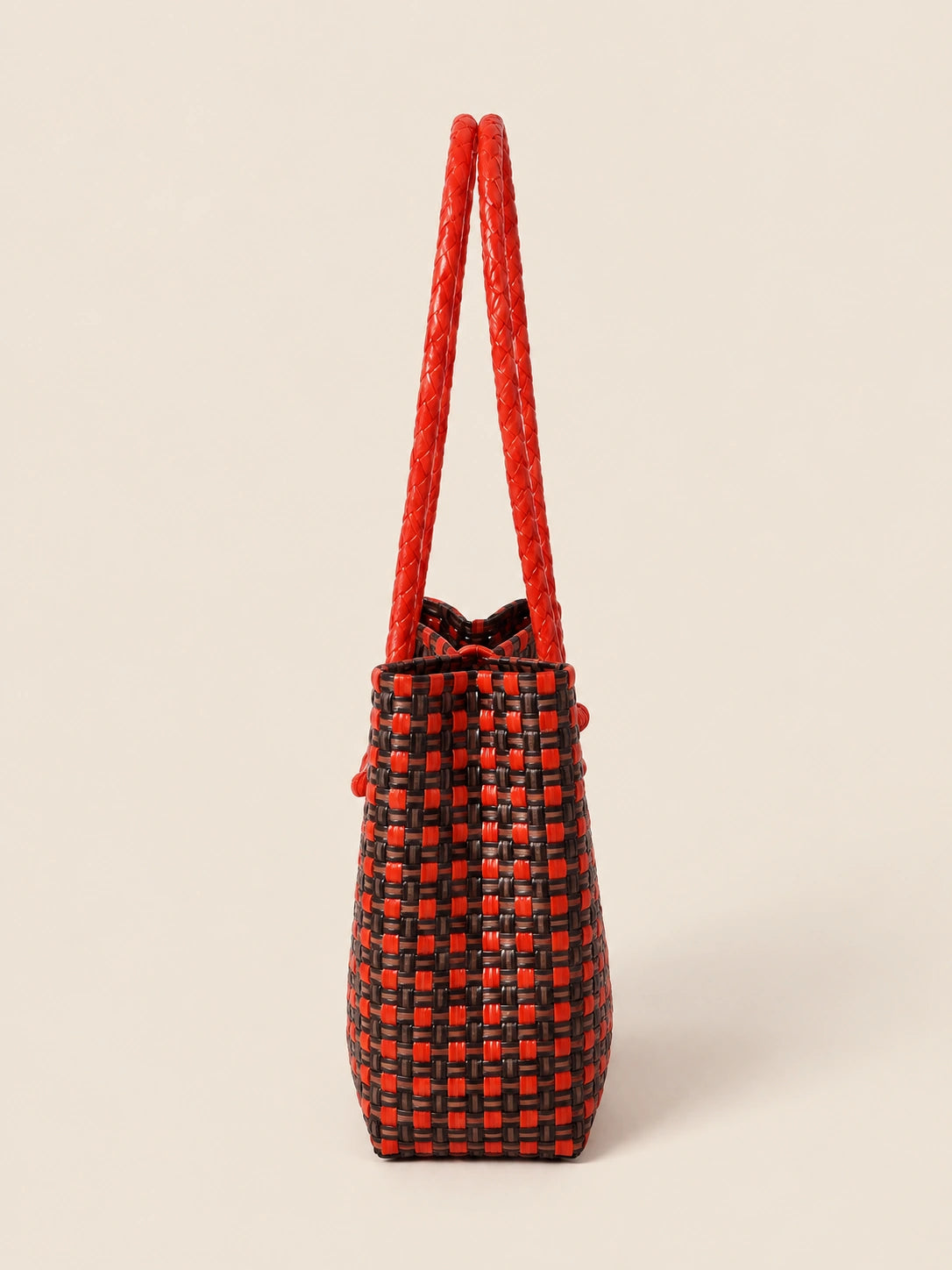 Habi Baga recycled-polypropylene structured bayong tote, side view